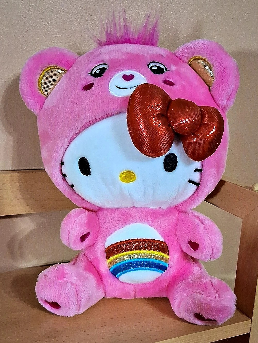 Sanrio Hello Kitty and Friends x Care Bears Hello Kitty Dressed as Cheer Bear.
